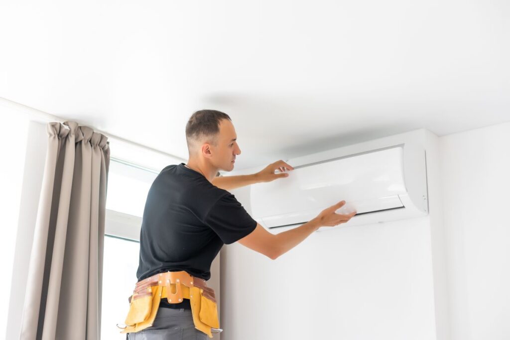 Man repairing air conditioner in Reno, Nevada